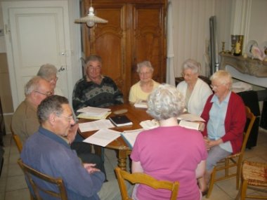 Sharon and the group, round the table at the retired priests house